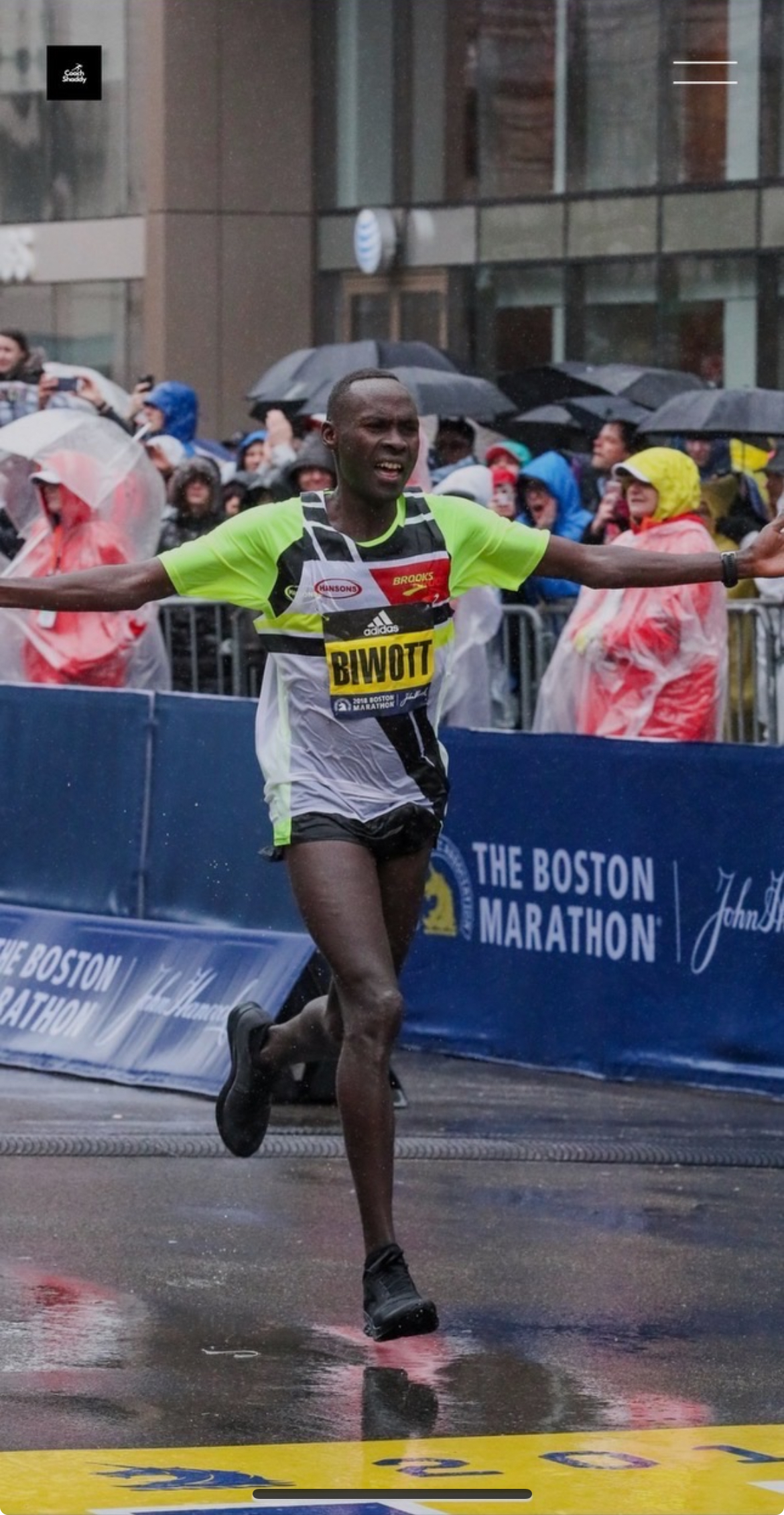Shadrack Biwott crossing the finish line at the 2018 Boston Marathon